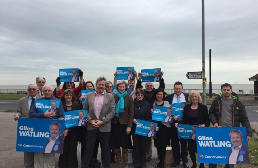 Giles Watling and Theresa May with activists in Holland on Sea