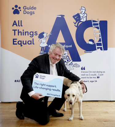 Giles with a guide dog